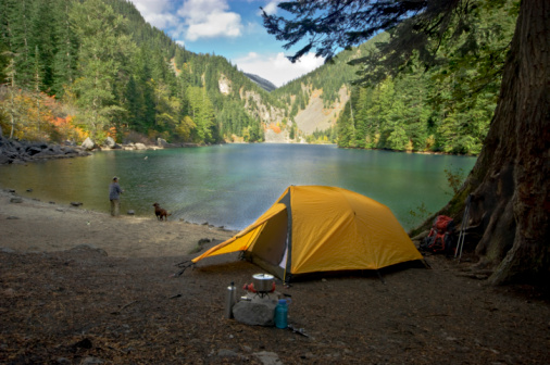 Fisherman camping at a wilderness lake